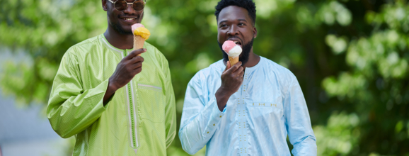 two young mean eating icecream