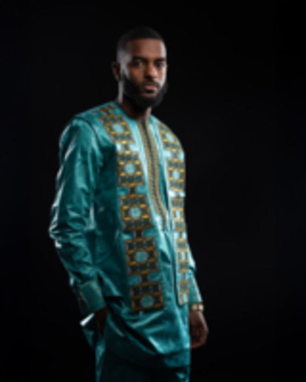 Man in rich embroidered turquoise boubou