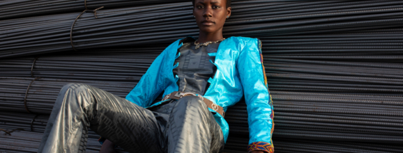 Model sitting on big cable looms