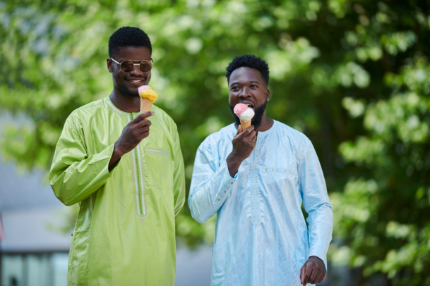 two young mean eating icecream