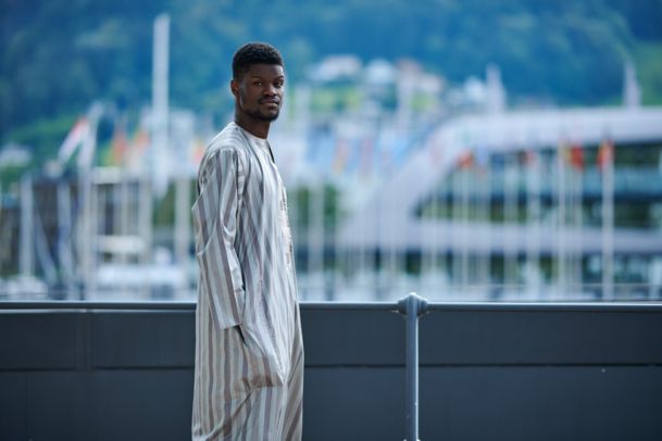 Man in front of a harbour